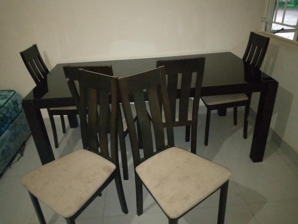 Neat 6 seater glass top dinning table going for K750